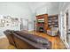 Living room with fireplace, built-in shelves, and open access to doors to the backyard at 404 Yorkfield Dr, Shelby, NC 28150