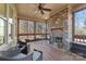 Cozy screened porch with a stone fireplace and comfortable seating at 404 Yorkfield Dr, Shelby, NC 28150