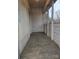 Outdoor back porch with worn floor is ready to be used and enjoyed by a new homeowner at 50 Ranlo Ave, Gastonia, NC 28054