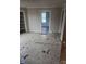 This bedroom with laminate flooring and a large doorway could be updated to a buyer's desires at 50 Ranlo Ave, Gastonia, NC 28054