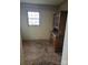 Smaller bedroom with wood paneling and a large hutch or cabinet could be converted to a home office or study at 50 Ranlo Ave, Gastonia, NC 28054