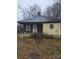 Quaint single Gathering home with covered front porch and compact yard needs some tender loving care at 50 Ranlo Ave, Gastonia, NC 28054