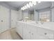 Bathroom featuring a double vanity and mirror at 11131 Cypress View Dr, Charlotte, NC 28262