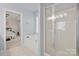 Bathroom with tub, shower, and access to bedroom at 11131 Cypress View Dr, Charlotte, NC 28262