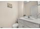 Clean bathroom with toilet, sink, and vanity at 11131 Cypress View Dr, Charlotte, NC 28262