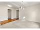 Dining room with neutral walls, carpet flooring, and modern light fixture at 11131 Cypress View Dr, Charlotte, NC 28262