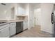 Kitchen features white cabinets and hardwood floor at 11131 Cypress View Dr, Charlotte, NC 28262