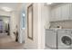 Convenient laundry room with washer, dryer, and storage at 11131 Cypress View Dr, Charlotte, NC 28262