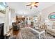 Open concept living room with hardwood floors and a view of kitchen and staircase at 1246 Gold Rush Ct, Fort Mill, SC 29708