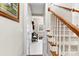 Staircase with wooden railing and neutral-toned carpeting at 1246 Gold Rush Ct, Fort Mill, SC 29708