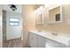 Double vanity bathroom with updated fixtures and mirrors at 202 Mountain View Dr, Taylorsville, NC 28681