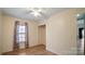 Bedroom with window, ceiling fan, and closet at 202 Mountain View Dr, Taylorsville, NC 28681