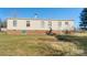 Rear view of a ranch-style home with brick foundation and large yard at 202 Mountain View Dr, Taylorsville, NC 28681