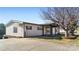 Beige ranch home with covered porch and spacious yard at 202 Mountain View Dr, Taylorsville, NC 28681