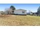 Side view of mobile home showcasing landscaping at 202 Mountain View Dr, Taylorsville, NC 28681