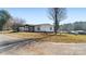 Single-wide mobile home with covered porch and spacious yard at 202 Mountain View Dr, Taylorsville, NC 28681