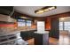 Open kitchen with dark cabinetry, island, and breakfast nook at 202 Mountain View Dr, Taylorsville, NC 28681