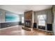 Living room featuring a stone fireplace and accent wall at 202 Mountain View Dr, Taylorsville, NC 28681