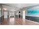 Open living space with hardwood floors and an accent wall at 202 Mountain View Dr, Taylorsville, NC 28681