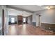 Spacious living area with wood-look floors and a fireplace at 202 Mountain View Dr, Taylorsville, NC 28681