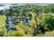 Picturesque aerial view showcasing a stunning home with a private pool and a lush, green backyard at 20400 Rainbow Cir, Cornelius, NC 28031