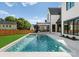 Relaxing pool features a spa with a serene backyard, perfect for entertaining or unwinding at 20400 Rainbow Cir, Cornelius, NC 28031