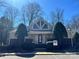 Charming clubhouse exterior with a symmetrical design, large windows, and a welcoming entrance at 2518 Cranbrook Ln, Charlotte, NC 28207