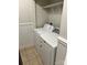 Dedicated laundry area features tile flooring and essential appliances for convenience at 2518 Cranbrook Ln, Charlotte, NC 28207