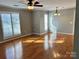 Bright living room features hardwood floors and plantation shutters for modern appeal at 2518 Cranbrook Ln, Charlotte, NC 28207