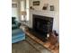 Fireplace with dark tile surround and hardwood hearth at 325 Queens Rd # 15, Charlotte, NC 28204