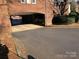 Covered parking garage entrance with brick facade at 325 Queens Rd # 15, Charlotte, NC 28204