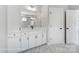 Bathroom with white vanity, hexagon tile floor, and built-in storage at 3252 Mcharney Dr # 37, Harrisburg, NC 28075