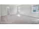 Large bedroom with carpet, walk-in closet and window at 3252 Mcharney Dr # 37, Harrisburg, NC 28075