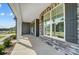 Covered front porch with stone and gray siding at 3252 Mcharney Dr # 37, Harrisburg, NC 28075