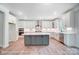 Modern kitchen with white cabinets and a large island at 3252 Mcharney Dr # 37, Harrisburg, NC 28075