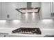 Gas cooktop with stainless steel range hood at 3252 Mcharney Dr # 37, Harrisburg, NC 28075