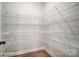 Walk-in pantry with wire shelving for ample storage at 3252 Mcharney Dr # 37, Harrisburg, NC 28075