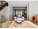 Open concept dining area with stairs, hardwood floors, and a modern design at 4026 Chevington Rd # 102, Charlotte, NC 28226