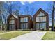 Modern home with contemporary design, large windows, a well-kept lawn, and an inviting driveway at 4026 Chevington Rd # 102, Charlotte, NC 28226