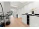 Bright hallway with skylight and modern accents and a view into another room at 4026 Chevington Rd # 102, Charlotte, NC 28226