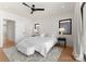 Bright main bedroom with a ceiling fan, a comfortable bed, and natural light at 4026 Chevington Rd # 102, Charlotte, NC 28226