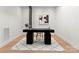 Contemporary office featuring a modern desk and a stylish black and white geometric rug at 4026 Chevington Rd # 102, Charlotte, NC 28226