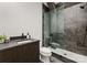 Modern bathroom with a glass shower, gray tile, and sleek black hardware at 4026 Chevington Rd # 103, Charlotte, NC 28226