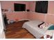 Spacious basement bedroom with a large TV and double bed at 5824 Crossing King Dr, Charlotte, NC 28212