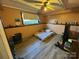 Finished basement bedroom with wood flooring and a ceiling fan at 5824 Crossing King Dr, Charlotte, NC 28212