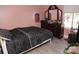 Bedroom with wood floors and dresser at 5824 Crossing King Dr, Charlotte, NC 28212