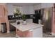 Modern kitchen with stainless steel appliances and island at 5824 Crossing King Dr, Charlotte, NC 28212