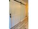 White barn door adds character to the interior at 6130 Heathstone Ln, Charlotte, NC 28210