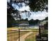 Community pool with gazebo and surrounding trees at 6130 Heathstone Ln, Charlotte, NC 28210