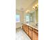 Primary bathroom with double sinks and tile floors at 1001 Jessica Ln, Matthews, NC 28104